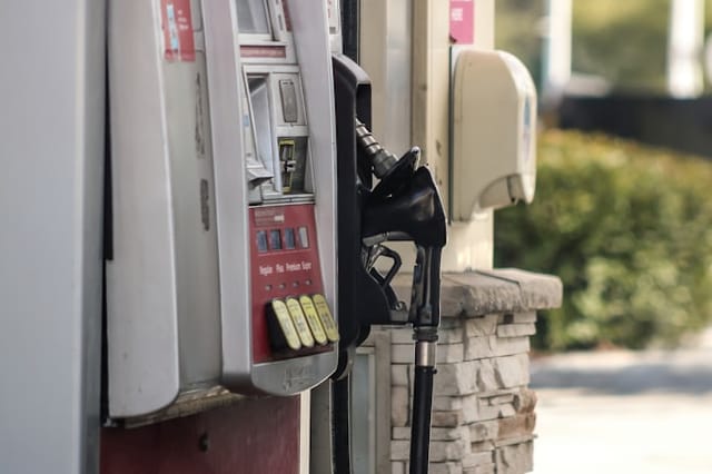 Close-up of a fuel pump nozzle at a filling station